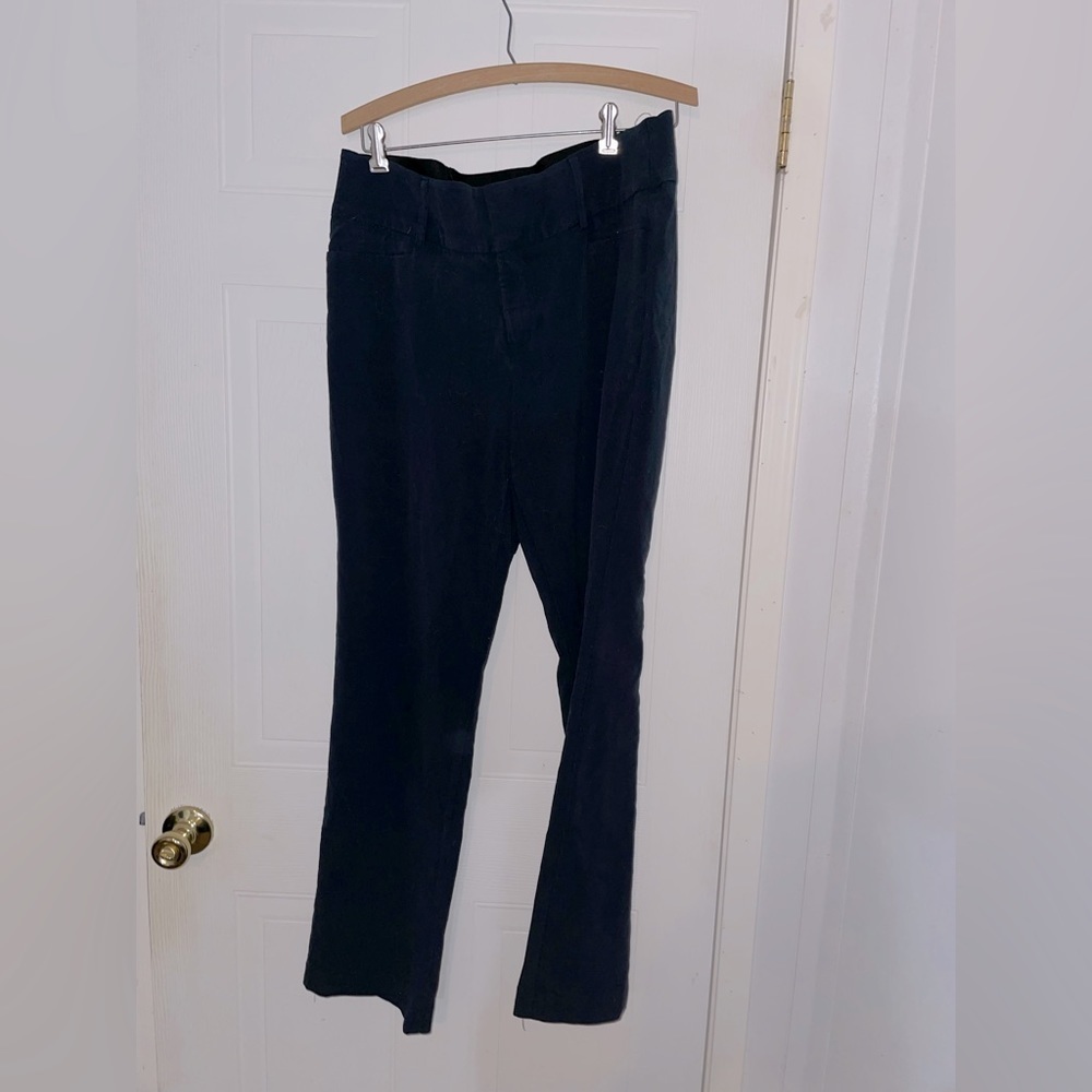 Navy blue stretchy dress pants with zipper and clasps.